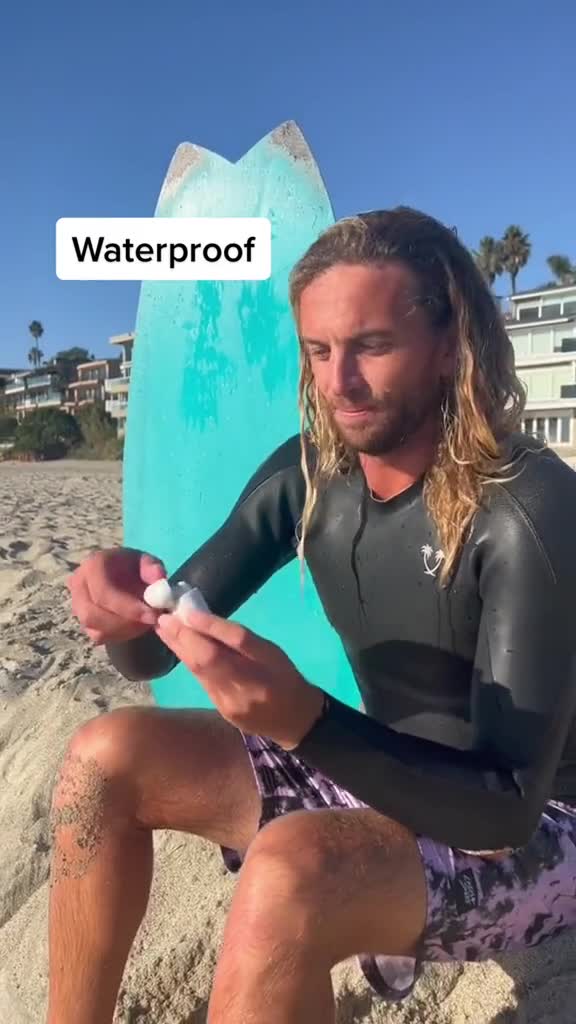 Surfer Blair Conklin wearing TOZO T6 waterproof earbuds