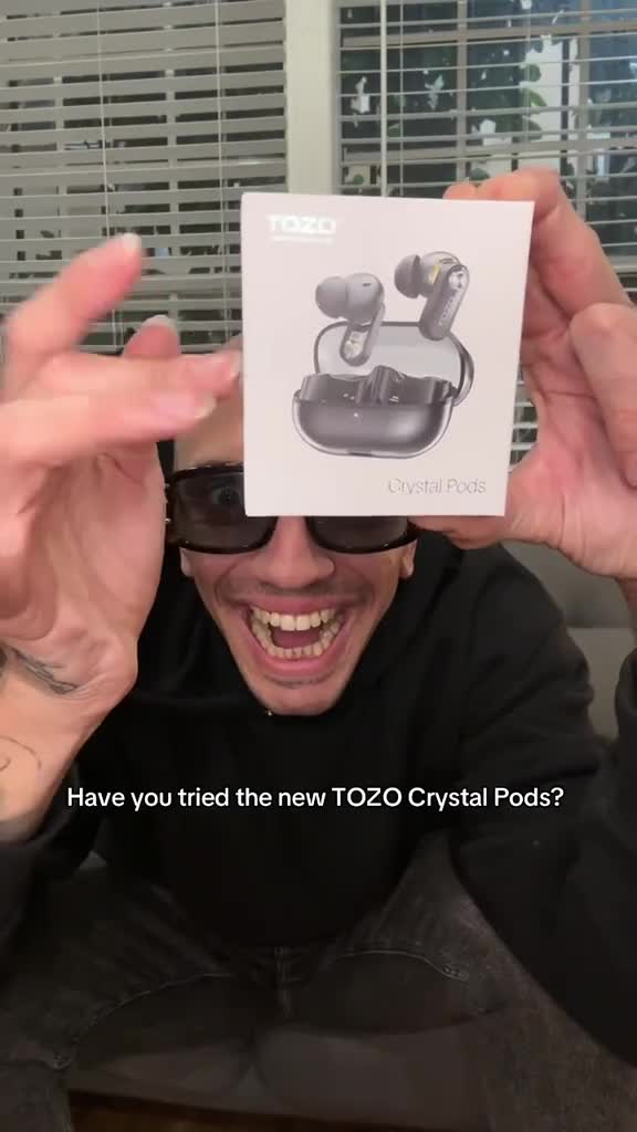 Guitarist listening with TOZO Crystal Pods